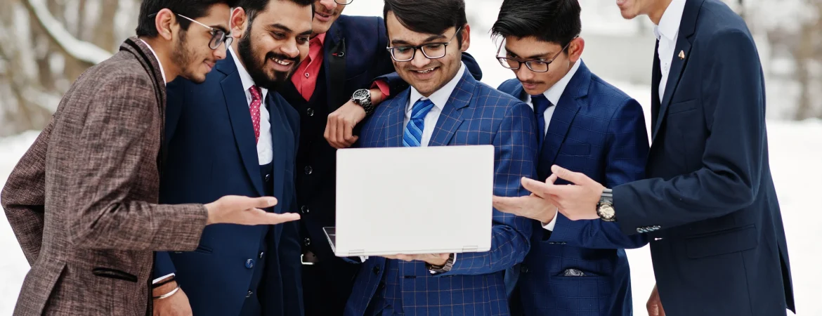 group-six-indian-businessman-suits-posed-outdoor-winter-day-europe-looking-laptop